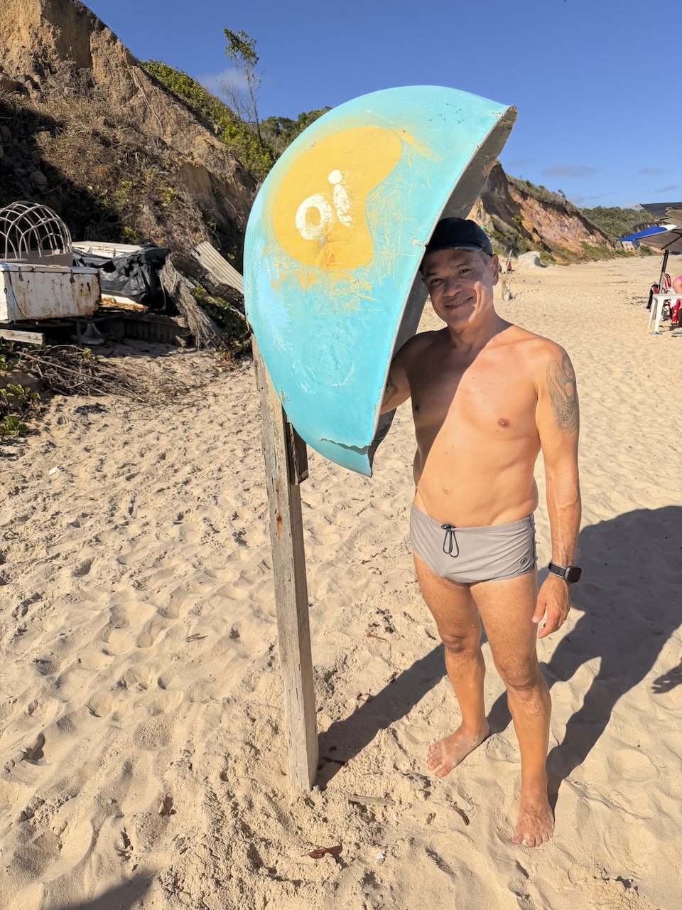 Saulo in 2025, lean and fit on a beach in Brazil
