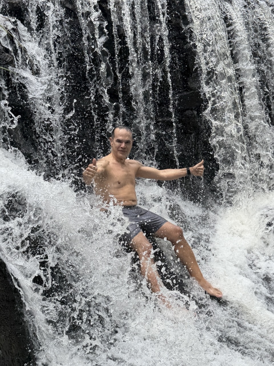 Saulo at a waterfall, fit and active